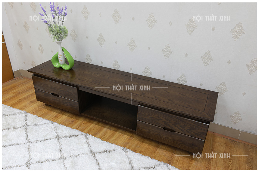 Kệ tivi phòng khách bằng gỗ sang trọng mang lại cho bạn một không gian sống sang trọng và đẳng cấp. Với chất liệu gỗ cao cấp và thiết kế đơn giản nhưng tinh tế, kệ tivi này sẽ làm cho phòng khách của bạn trở nên đẹp và thể hiện gu thẩm mỹ tinh tế của bạn.